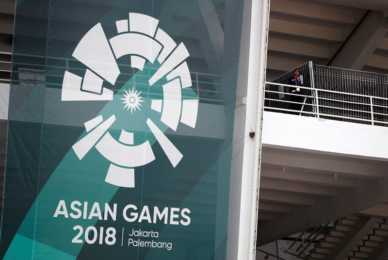 © Reuters. A firefighter stands during a drill at the main stadium ahead of the upcoming Asian Games at Gelora Bung Karno sports complex in Jakarta