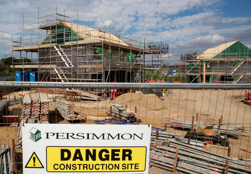 © Reuters. FILE PHOTO:  A warning sign is displayed at a Persimmon construction site in Dartford