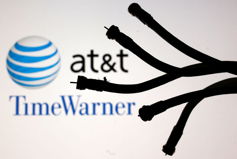 © Reuters. Coaxial TV Cables are seen in front of AT&T and Time Warner logos in this picture illustration