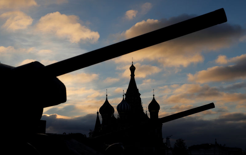 © Reuters. FILE PHOTO: Soviet armoured vehicles are seen in front of the St. Basil's cathedral during a rehearsal for a military parade at the Red Square in Moscow