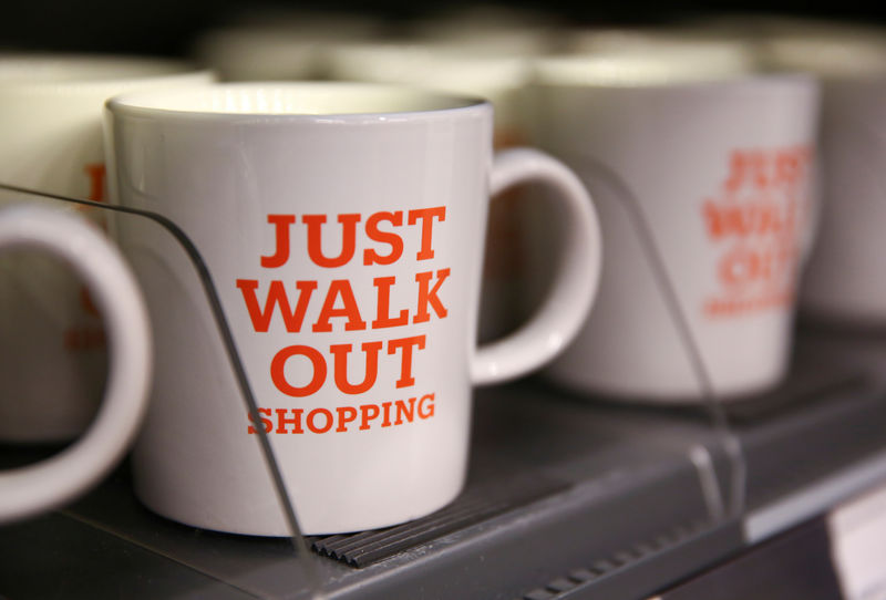 © Reuters. FILE PHOTO: Mugs that advertise the store's convenience are for sale in the new Amazon Go store in Seattle