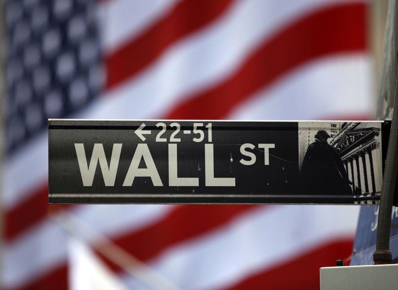 © Reuters. The Wall Street sign is seen outside the New York Stock Exchange