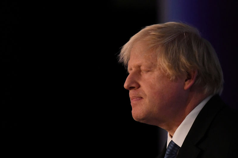 © Reuters. FILE PHOTO: Conservative MP Boris Johnson speaks at the DUP annual party conference in Belfast