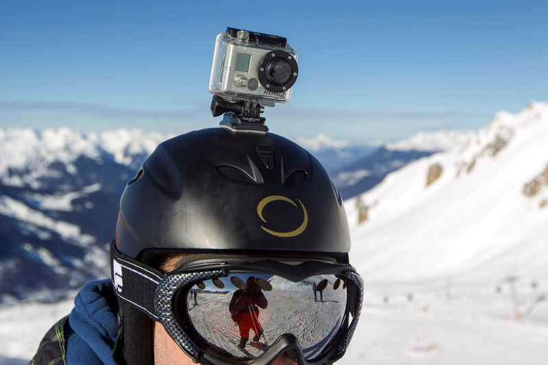 © Reuters. FILE PHOTO: A skier wears a GoPro camera on his helmet as he rides down the slopes in the ski resort of Meribel