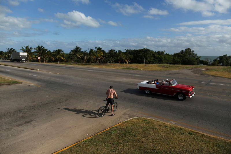 © Reuters. Tourists ride in a U.S. vintage car in Varadero