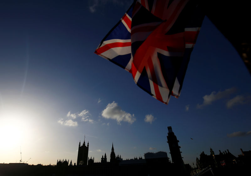 © Reuters. A union flag is seen for sale at a kiosk on Westminster Bridge opposite the Houses of Parliament in London
