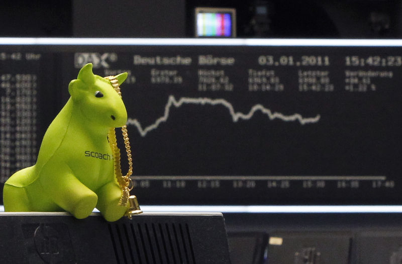 © Reuters. Polystyrene figure of a bull is pictured in front of the DAX board during the first trading day at the Frankfurt stock exchange
