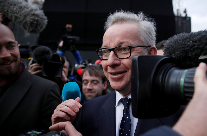© Reuters. Britain's Secretary of State for Environment, Food and Rural Affairs, Michael Gove, is surrounded be members of the media on Abingdon Green, in central London