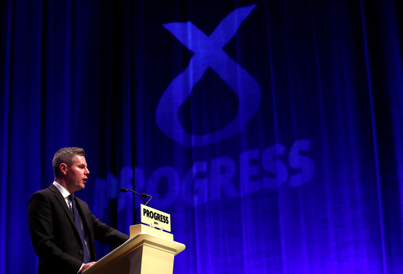 © Reuters. Scotland's Finance Minister, Derek Mackay, speaks at the Scottish National Party conference in Glasgow