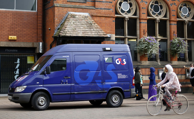 © Reuters. A G4S security van is parked outside a bank in Loughborough