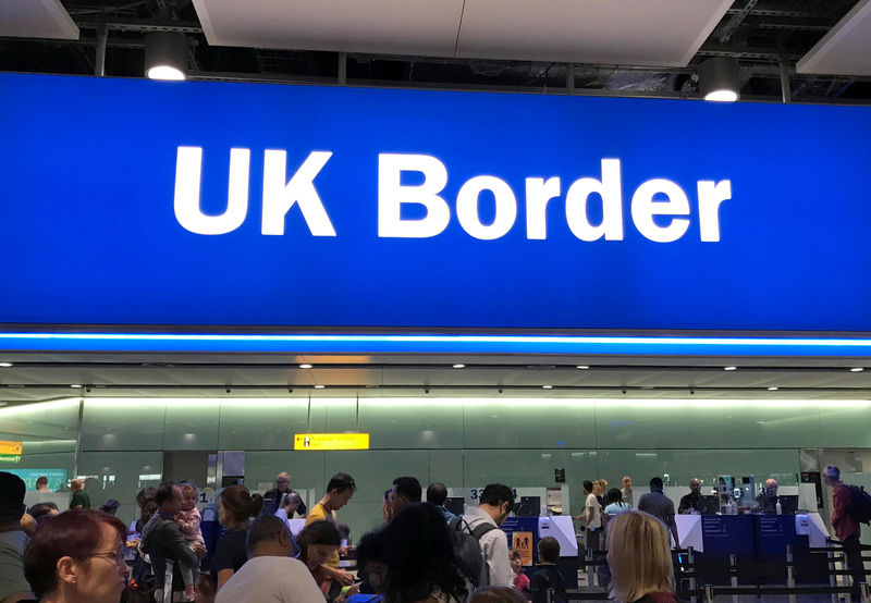© Reuters. Signage is seen at the UK border control point at the arrivals area of Heathrow Airport, London