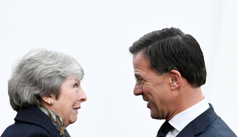 © Reuters. FILE PHOTO: British PM May is welcomed by Dutch PM Rutte