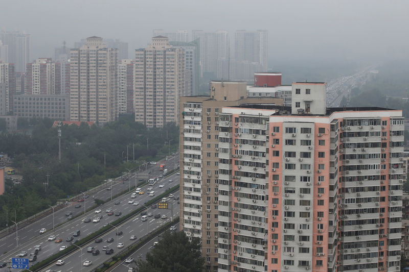 © Reuters. FILE PHOTO:  Residential buildings are seen along the Fourth Ring Road in Beijing