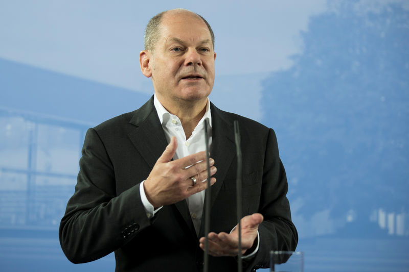 © Reuters. FILE PHOTO: German Finance Minister Olaf Scholz attends a press conference after the federal cabinet meeting in Potsdam