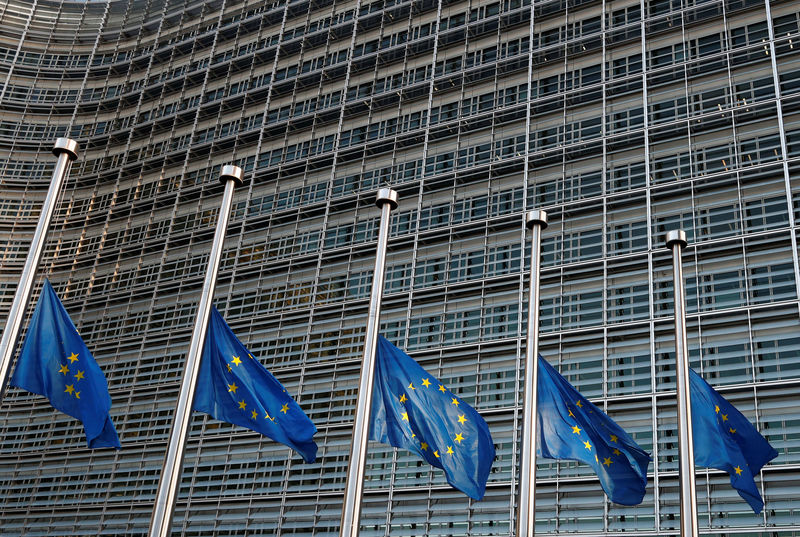 © Reuters. FILE PHOTO - EU flags are seen at half-mast to pay tribute to the victims of the attack in Strasbourg, outside the EU Commission headquarters in Brussels