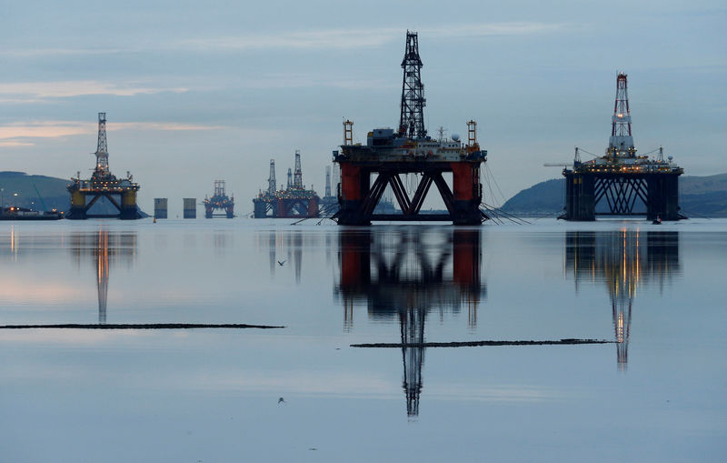 © Reuters. FILE PHOTO: Drilling rigs are parked up in the Cromarty Firth near Invergordon, Scotland