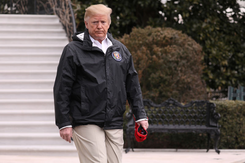 © Reuters. U.S. President Trump walks out to talk to reporters as he departs for travel to Alabama and Florida from the White House in Washington