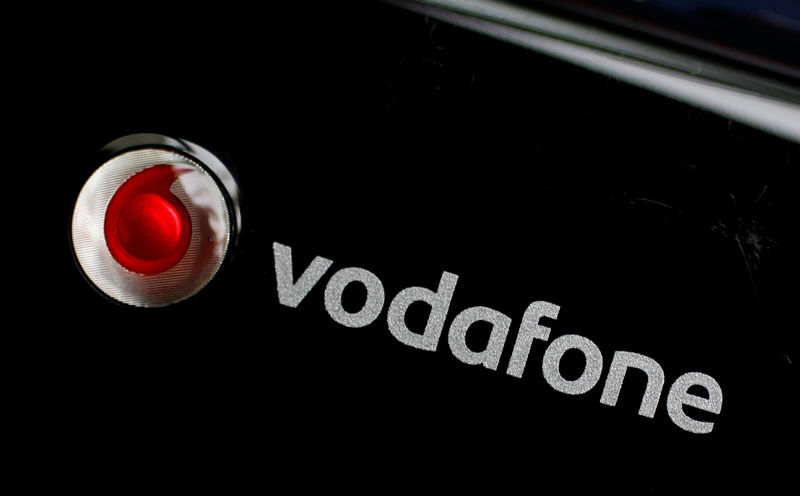 © Reuters. FILE PHOTO:  A Vodafone logo is seen on a mobile internet dongle in this photo illustration