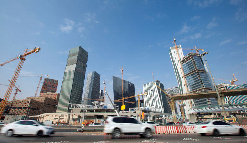 © Reuters. Cars drive past the King Abdullah Financial District in Riyadh