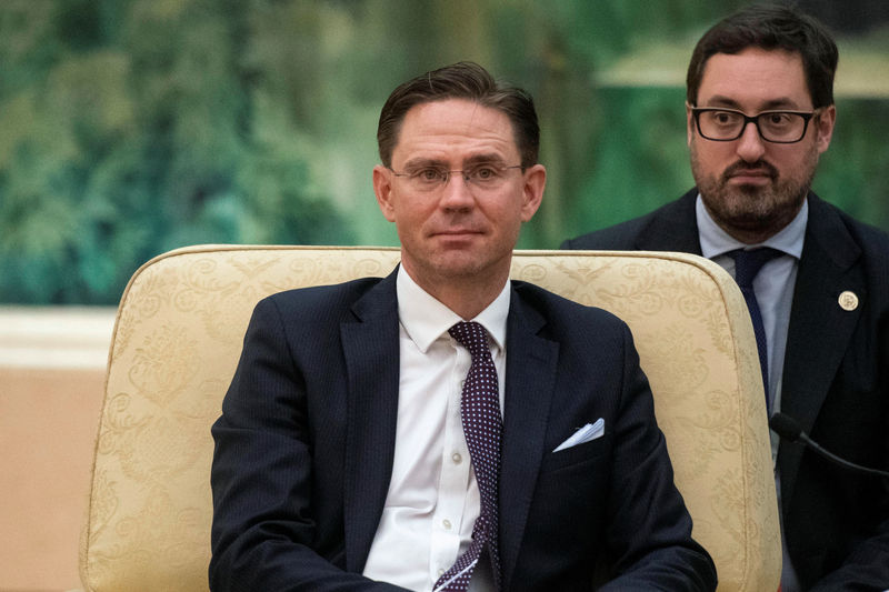 © Reuters. European Commission Vice President Jyrki Katainen listens China's Premier Li Keqiang (not pictured) during a meeting at the Great Hall of the People in Beijing