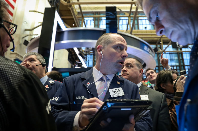 © Reuters. Traders work on the floor at the post where Boeing is traded at the NYSE in New York