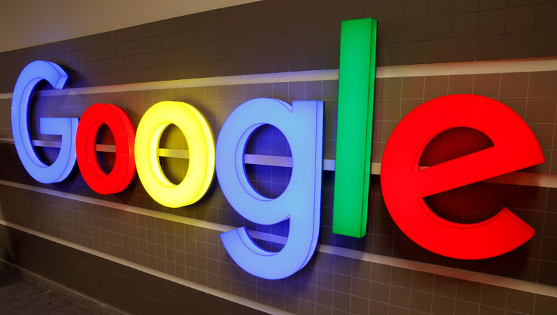 © Reuters. FILE PHOTO: An illuminated Google logo is seen inside an office building in Zurich