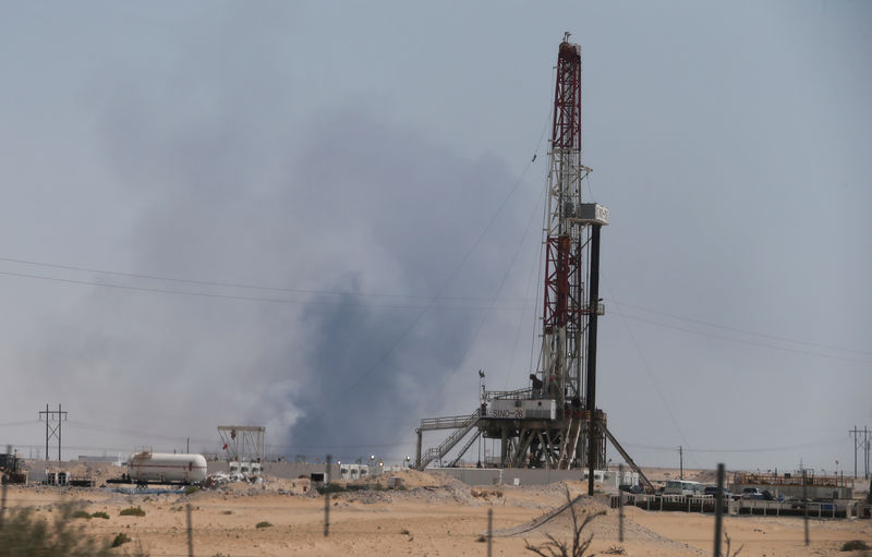 © Reuters. Smoke is seen following a fire at Aramco facility in the eastern city of Abqaiq