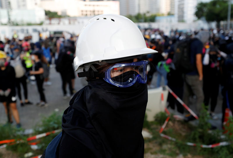 Hong Kong police fire tear gas, blue water jets at petrol-bomb throwing protesters