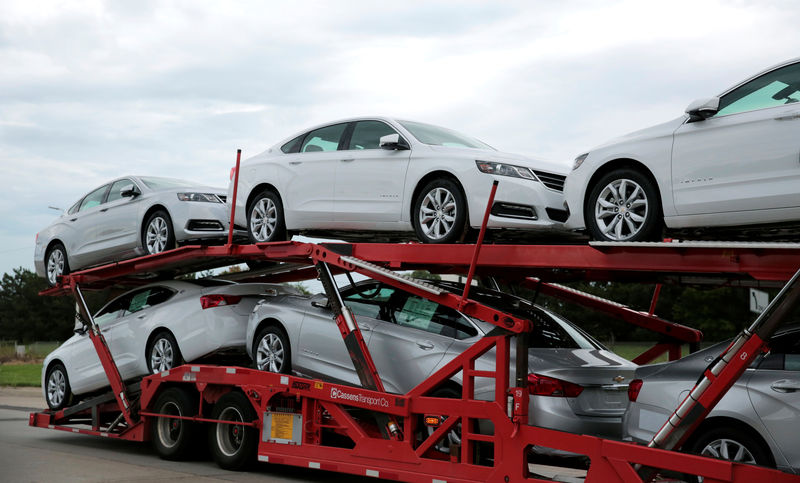 © Reuters. Car hauler transports newly built Chevrolet Impalas from the General Motors Detroit-Hamtramck plant in Detroit
