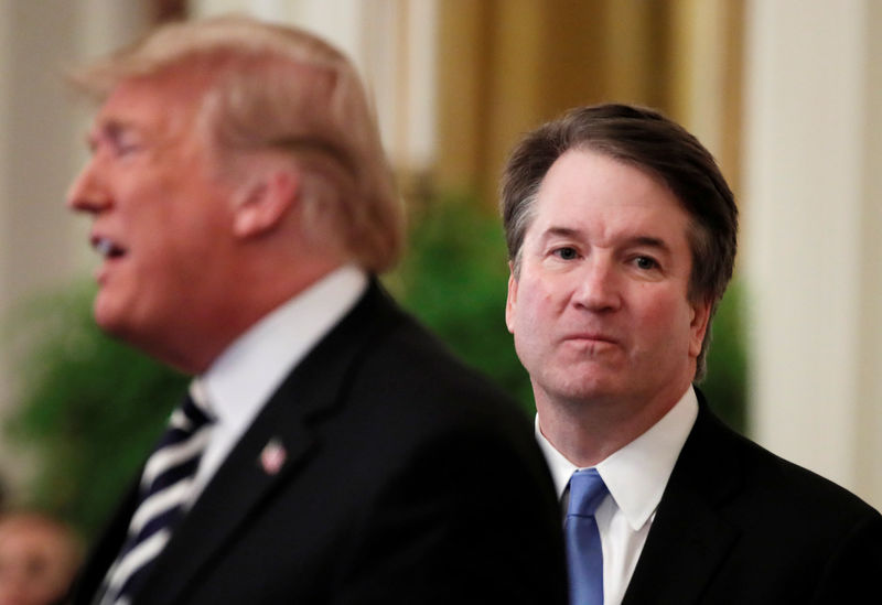 © Reuters. FILE PHOTO: U.S. President Donald Trump speaks next to U.S. Supreme Court Associate Justice Brett Kavanaugh as they participate in a ceremonial public swearing-in in the East Room of the White House in Washington