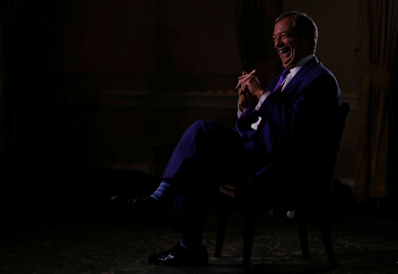 © Reuters. Britain's Brexit Party leader Nigel Farage laughs during an interview with Reuters in Southport, Britain