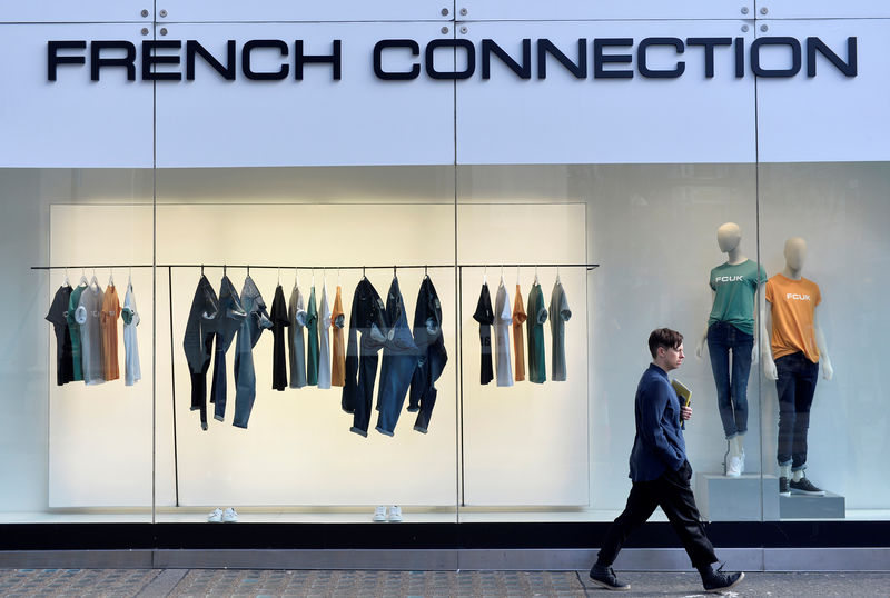 © Reuters. FILE PHOTO: A person walks past a French Connection store in London, Britain