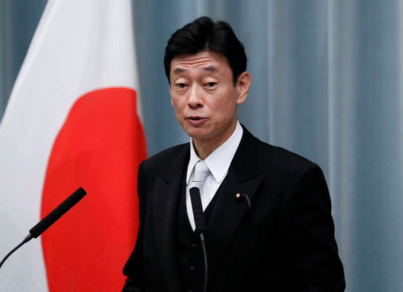 © Reuters. Japan's Economy Minister Nishimura attends a news conference at PM Abe's official residence in Tokyo