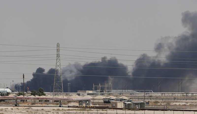 © Reuters. FILE PHOTO: Smoke is seen following a fire at Aramco facility in the eastern city of Abqaiq