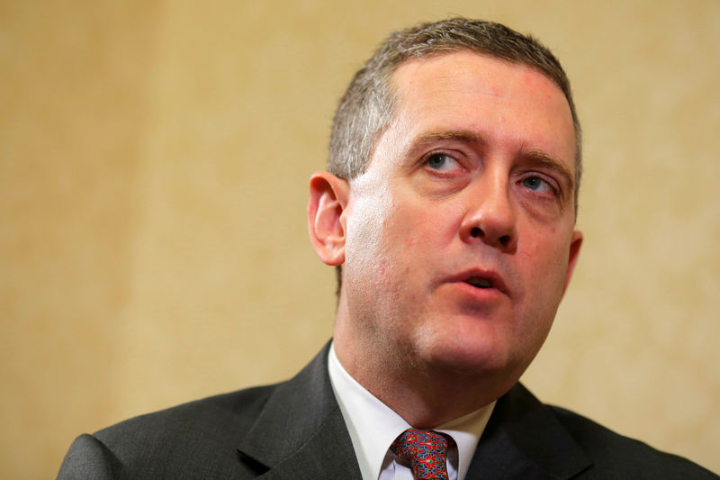 © Reuters. FILE PHOTO: James Bullard, President of the St. Louis Federal Reserve Bank, speaks during an interview with Reuters in Boston