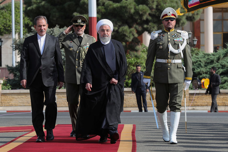 © Reuters. Iranian President Hassan Rouhani walks during a farewell ceremony before leaving for New York, in Tehran