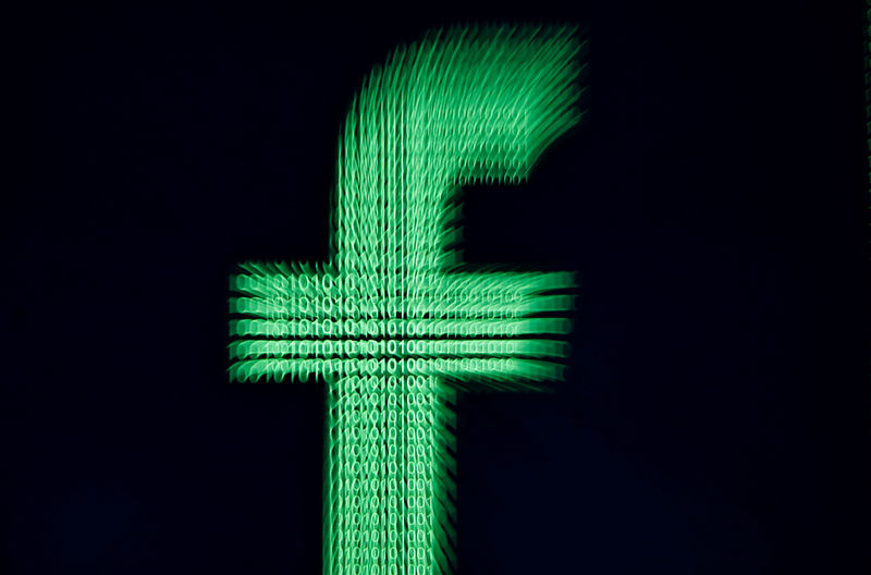 © Reuters. FILE PHOTO: A 3D-printed Facebook logo is displayed in front of binary digits in this illustration