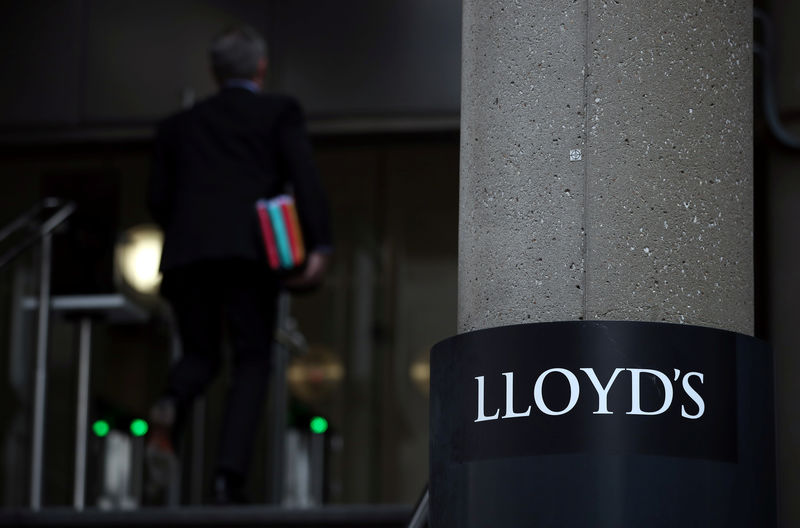© Reuters. FILE PHOTO:  Man enters the Lloyd's of London building in the City of London financial district