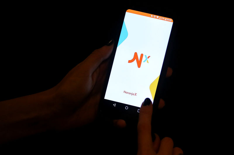 © Reuters. FILE PHOTO: The Naranja X app loads on a cellphone in this illustration picture