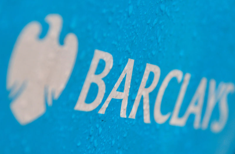 © Reuters. FILE PHOTO: Raindrops are seen on the logo of a rental bicycle sponsored by Barclays in London