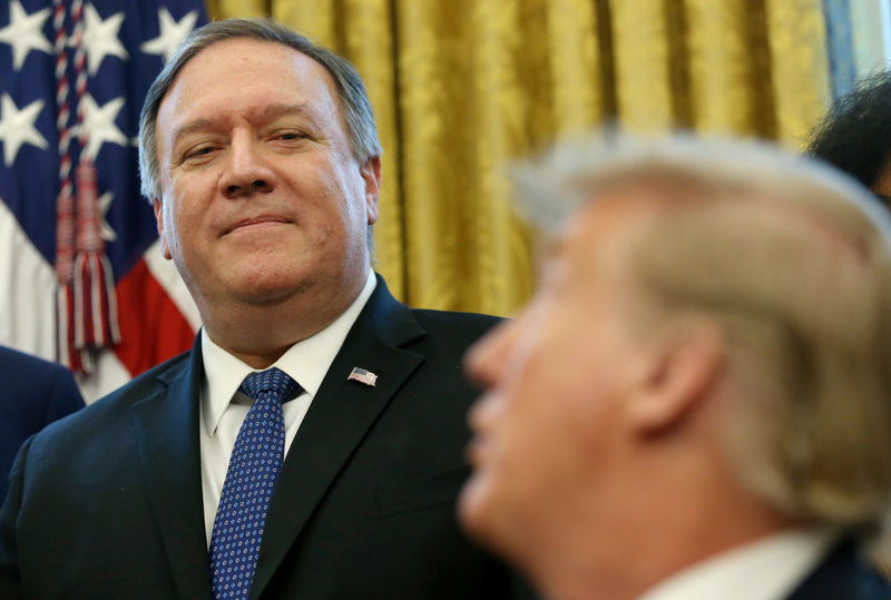 © Reuters. FILE PHOTO: President Trump calls on Secretary of StatePompeo durig signing ceremony at the White House in Washington