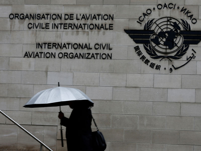 © Reuters. FILE PHOTO: A pedestrian walks past the International Civil Aviation Organization (ICAO) headquarters building in Montreal