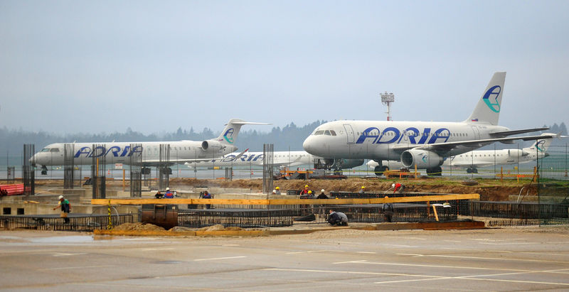 © Reuters. FILE PHOTO: Planes of Adria Airways are seen at the airport in Brnik