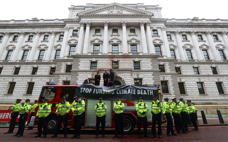 © Reuters. Extinction Rebellion protest outside the Treasury building in London