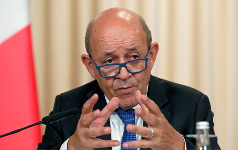 © Reuters. FILE PHOTO: French Foreign Minister Jean-Yves Le Drian at a September Meeting in Moscow