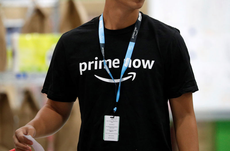 © Reuters. FILE PHOTO: An employee works at Amazon's Prime Now fulfilment centre in Singapore