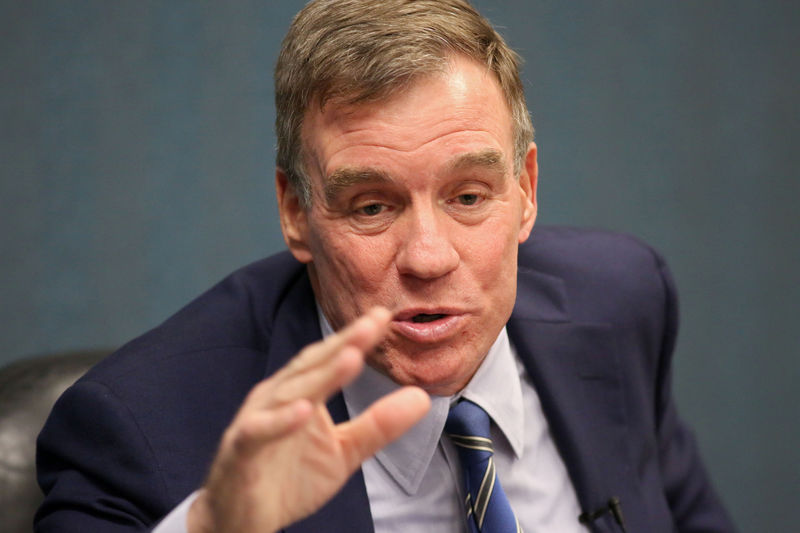 © Reuters. Sen. Mark Warner (D-VA) talks with military families about their hazardous living conditions during a meeting at the Peninsula Workforce Development Office in Newport News