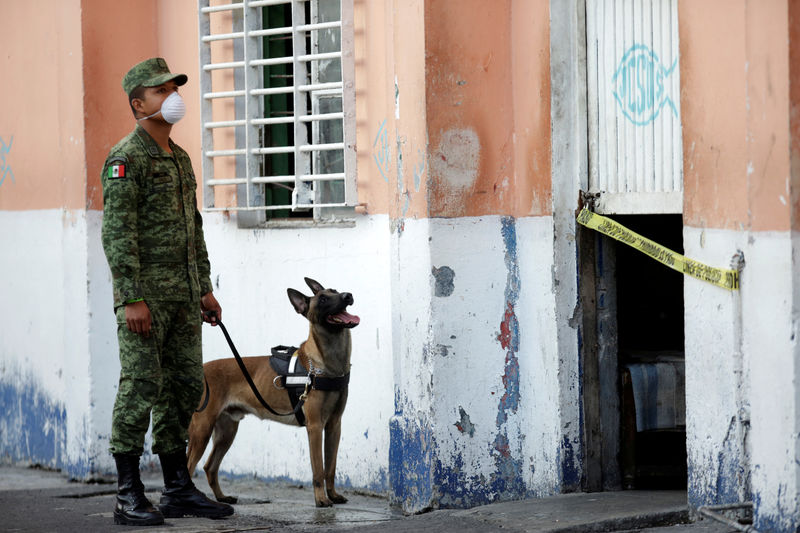Police, dogs search notorious Mexican prison for clandestine graves