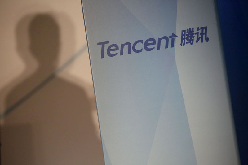 © Reuters. File photo of Tencent company name at a news conference in Hong Kong
