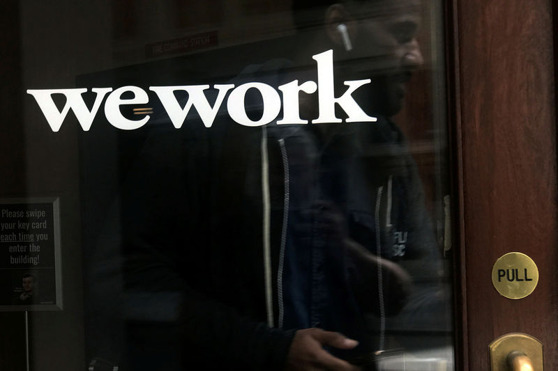 © Reuters. FILE PHOTO: A man walks out of a WeWork space in the Manhattan borough of New York City